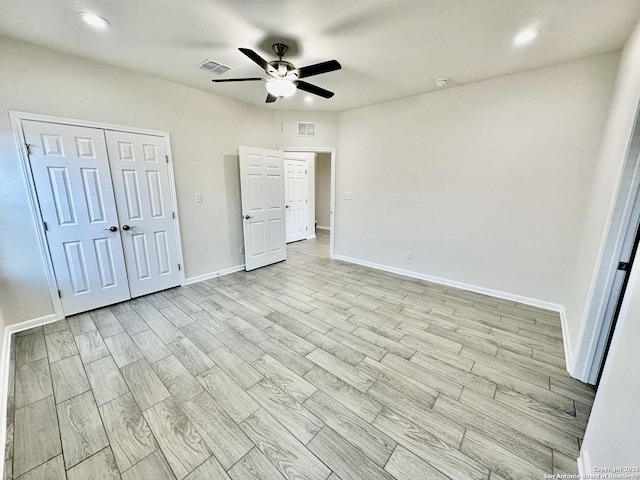 unfurnished bedroom featuring ceiling fan