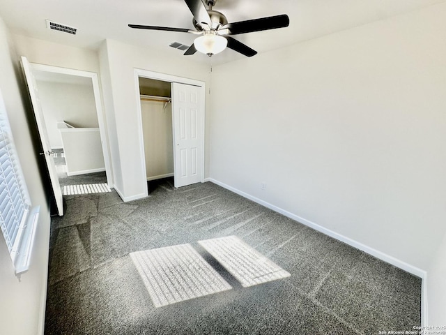 unfurnished bedroom featuring carpet, ceiling fan, and a closet