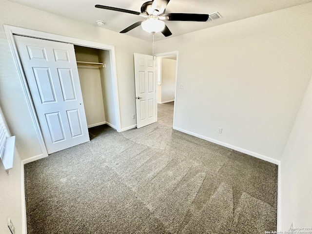 unfurnished bedroom with ceiling fan, a closet, and light carpet