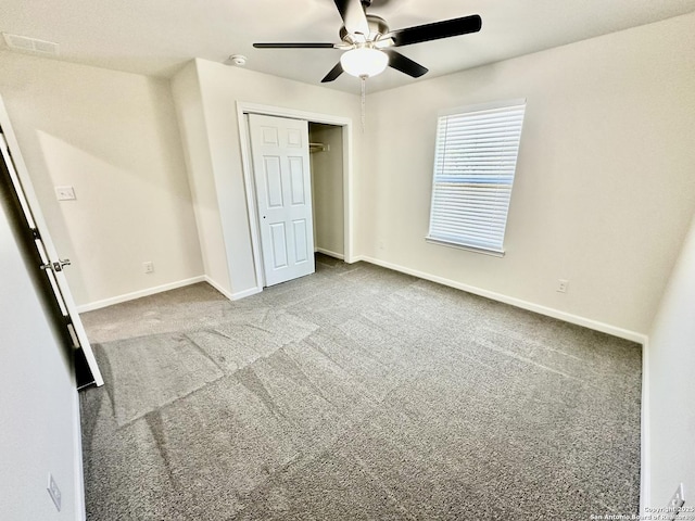 unfurnished bedroom with ceiling fan and carpet floors