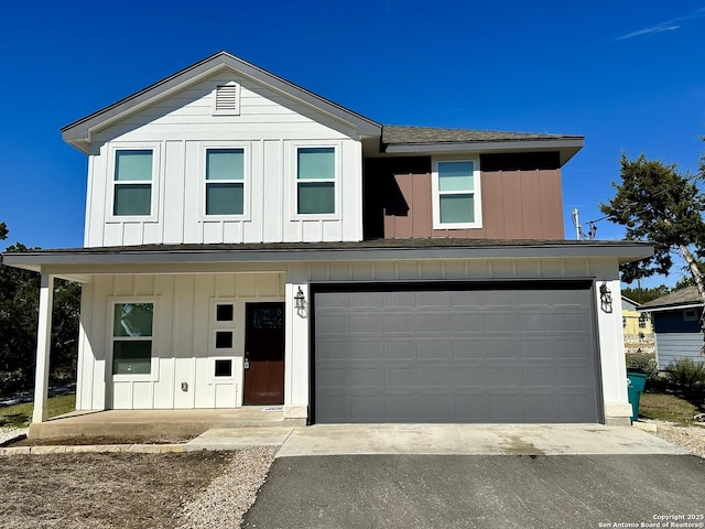 view of front facade with a porch and a garage