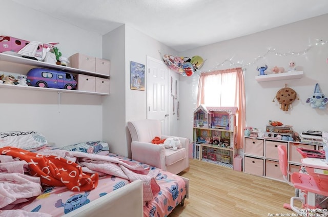 bedroom featuring hardwood / wood-style flooring