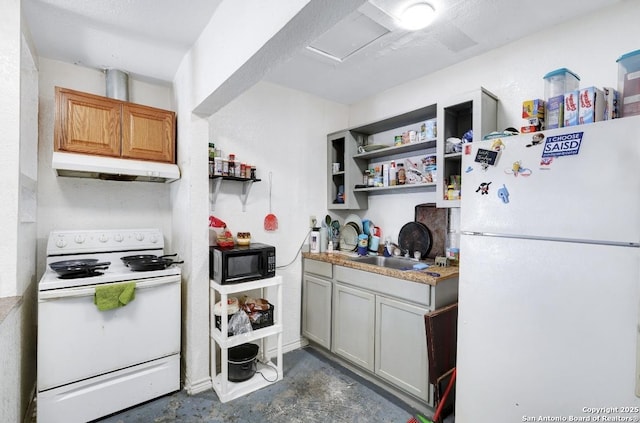 kitchen featuring sink and white appliances