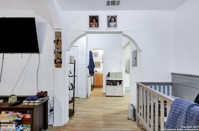 hall with light hardwood / wood-style floors