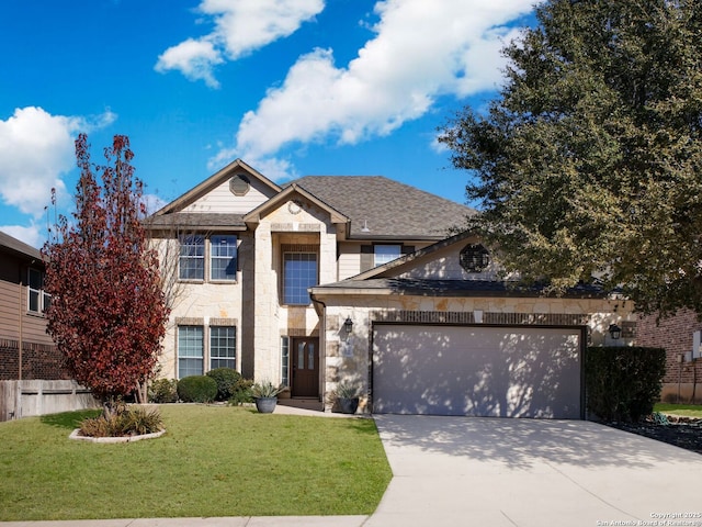 view of front of home with a garage and a front lawn