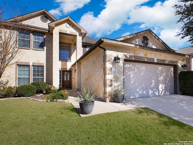 view of front of property with a garage and a front lawn