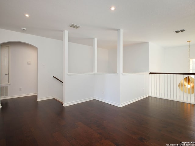 spare room featuring dark hardwood / wood-style flooring