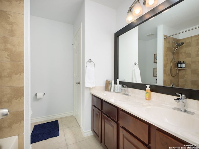 bathroom featuring vanity, tile patterned floors, and toilet