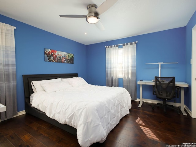 bedroom featuring dark hardwood / wood-style floors and ceiling fan