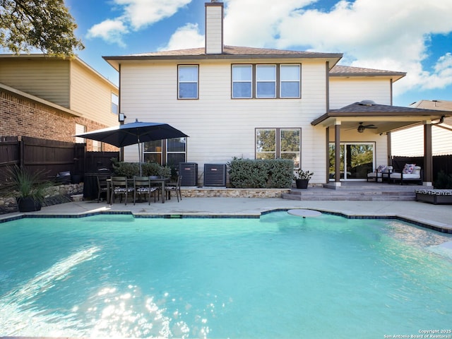 view of swimming pool with central AC unit, an outdoor living space, a patio, and ceiling fan