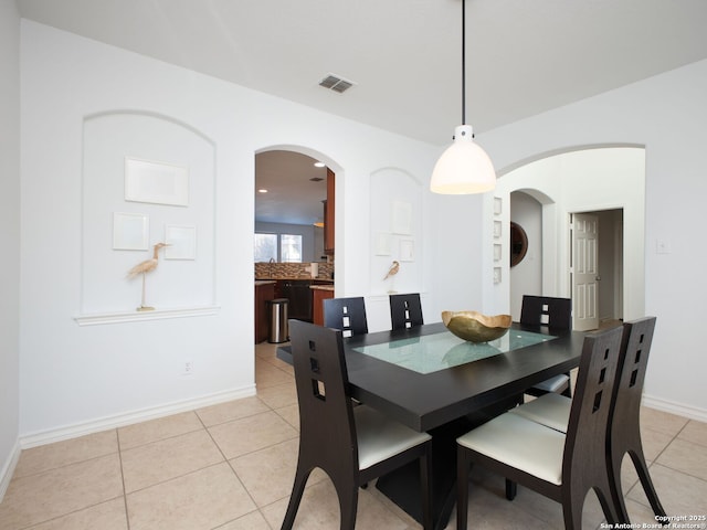 dining space with light tile patterned floors