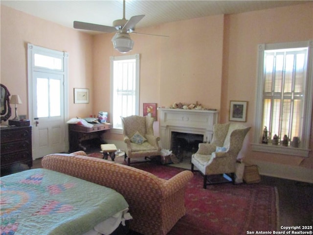 bedroom with multiple windows and ceiling fan