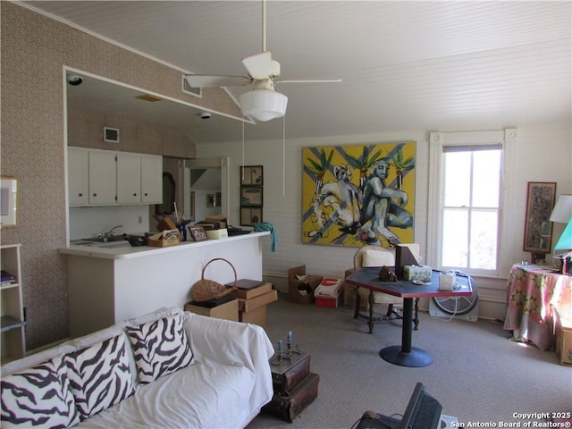 bedroom featuring light carpet and ceiling fan