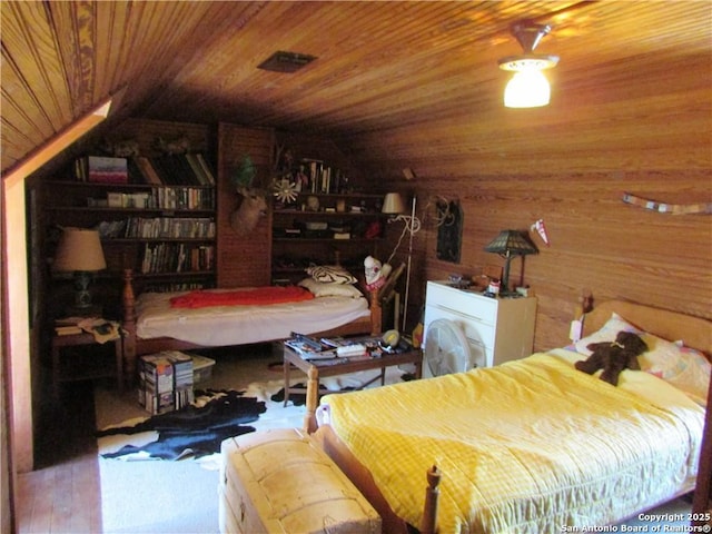 bedroom featuring wooden ceiling, vaulted ceiling, wood-type flooring, and wood walls