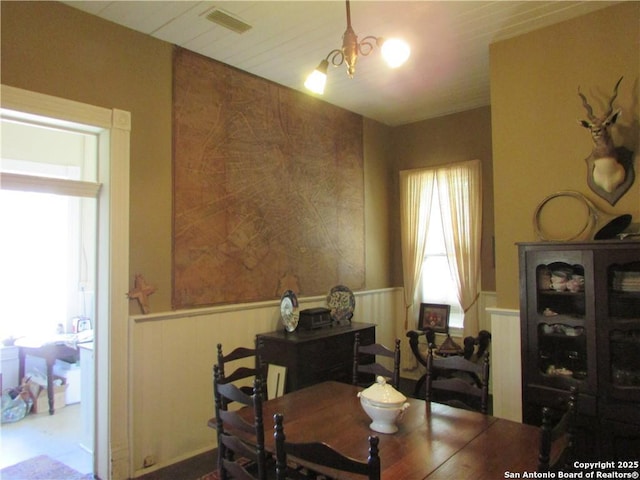 dining area with an inviting chandelier