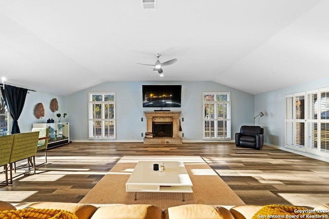 living room featuring vaulted ceiling, ceiling fan, and hardwood / wood-style floors