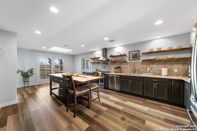 dining area with sink and light wood-type flooring