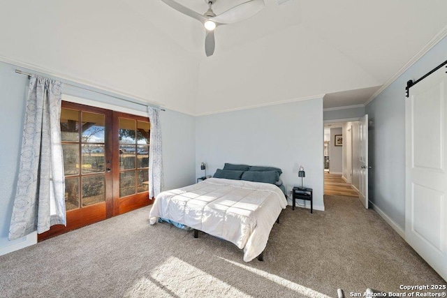 bedroom featuring a barn door, carpet floors, high vaulted ceiling, and ceiling fan