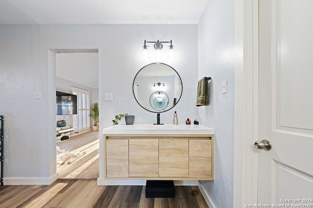 bathroom with wood-type flooring and vanity