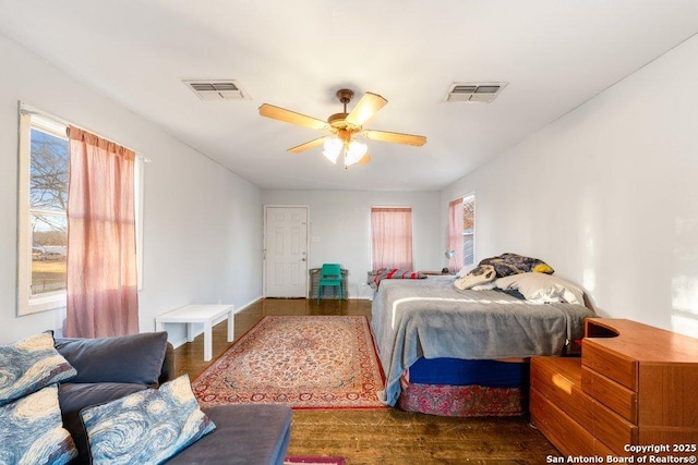 bedroom with wood-type flooring and ceiling fan