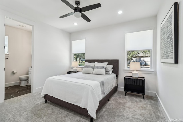 bedroom with recessed lighting, carpet flooring, connected bathroom, and baseboards