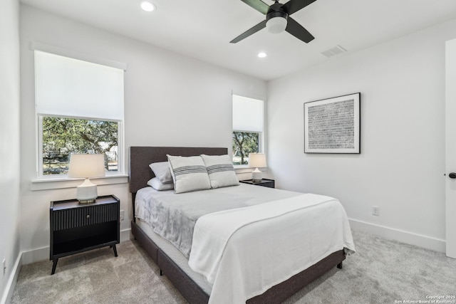 carpeted bedroom featuring a ceiling fan, recessed lighting, visible vents, and baseboards