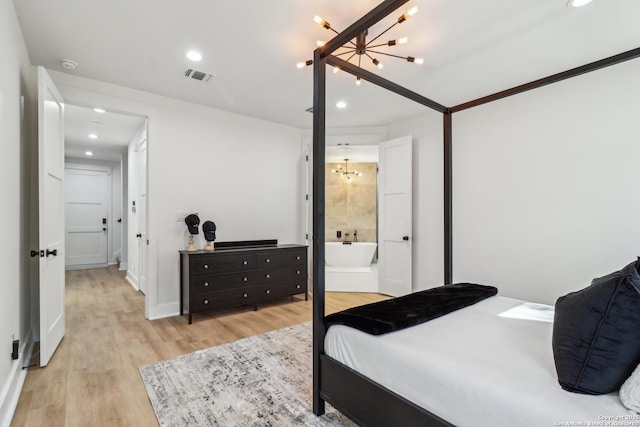 bedroom with recessed lighting, connected bathroom, visible vents, and light wood-style floors