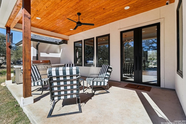 view of patio / terrace with ceiling fan, french doors, area for grilling, and outdoor dining space