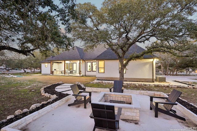 exterior space featuring an outdoor fire pit