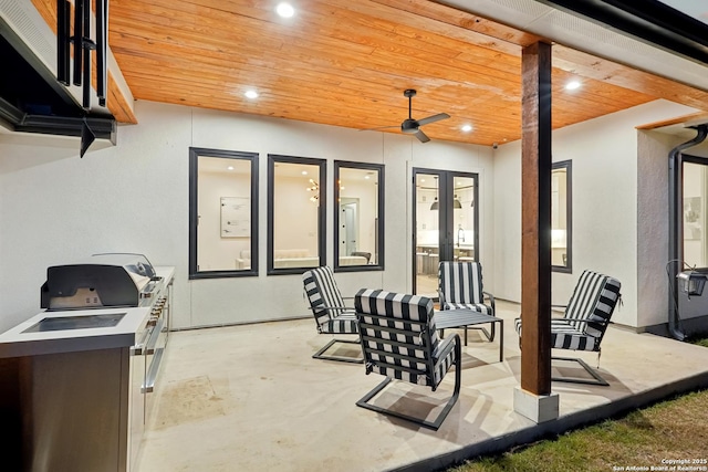 view of patio / terrace featuring a ceiling fan and french doors