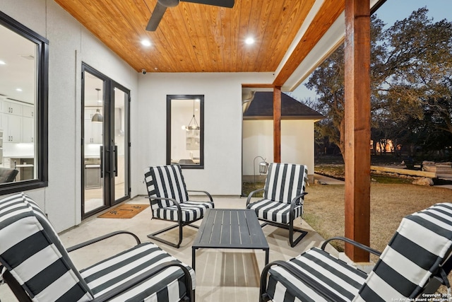 view of patio / terrace featuring ceiling fan and an outdoor living space