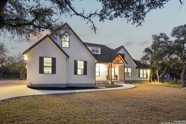 view of front of home with a lawn