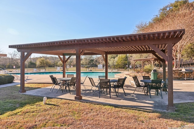 view of home's community featuring a swimming pool, fence, a pergola, and a patio