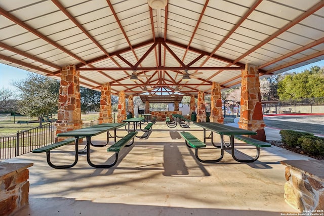 view of community with fence and a gazebo