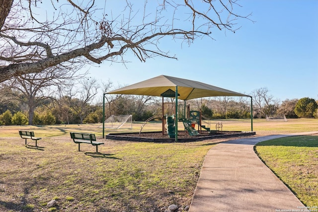 communal playground featuring a lawn