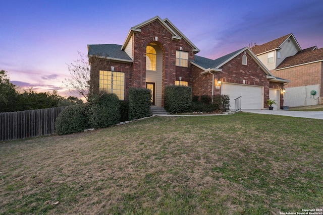 view of front property featuring a garage and a lawn