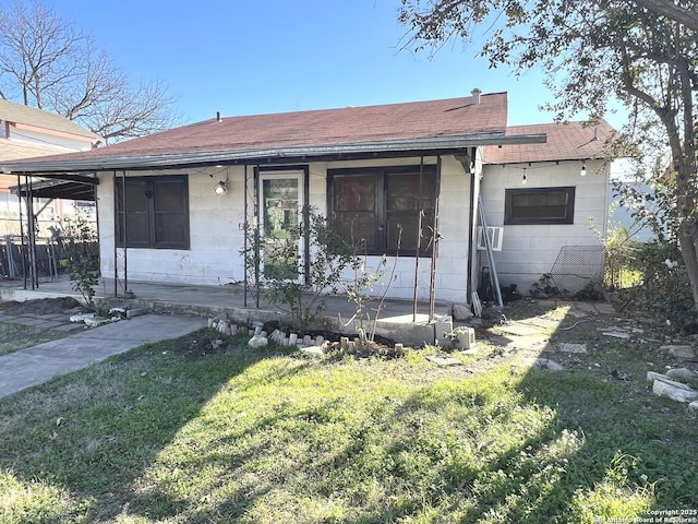 exterior space with a porch and a front lawn