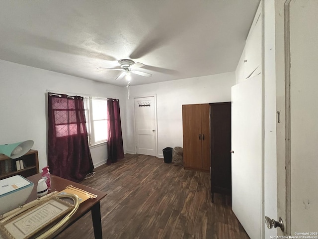 office area with dark hardwood / wood-style floors and ceiling fan