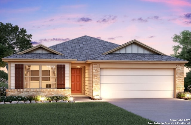 view of front of home with a garage, concrete driveway, roof with shingles, board and batten siding, and brick siding