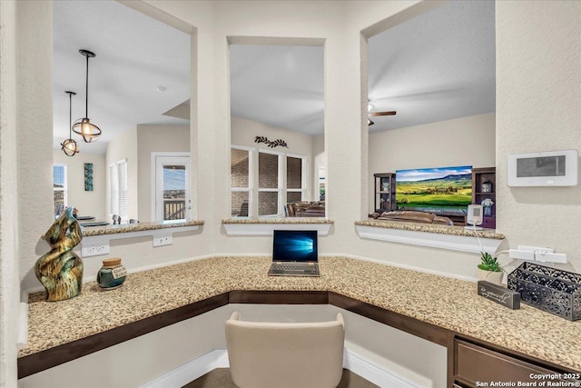 office area featuring built in desk and ceiling fan