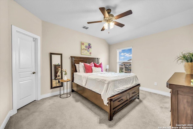 bedroom featuring lofted ceiling, light carpet, and ceiling fan