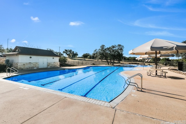 view of swimming pool with a patio area