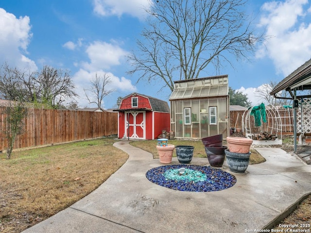 view of patio with a storage shed