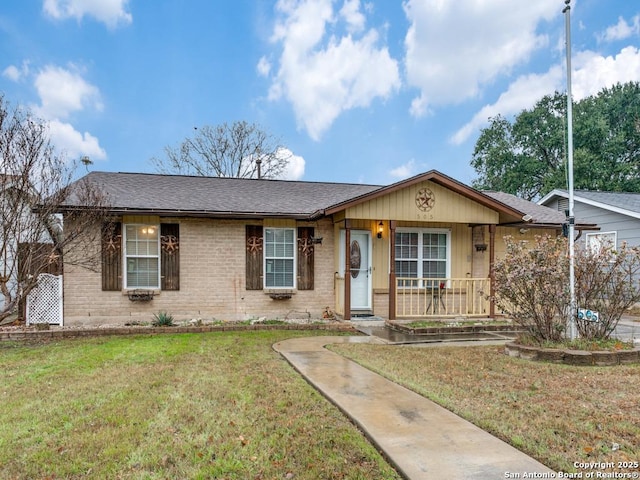 ranch-style home featuring a front yard and a porch