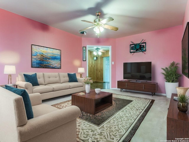 living room with light carpet and ceiling fan