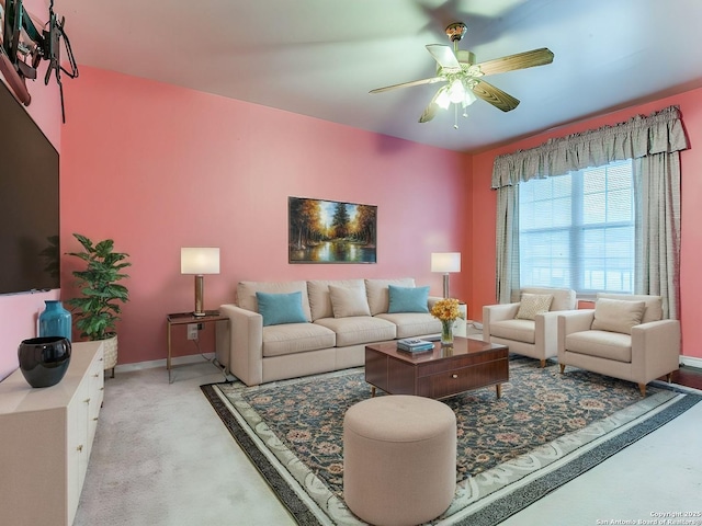 living room with light carpet and ceiling fan