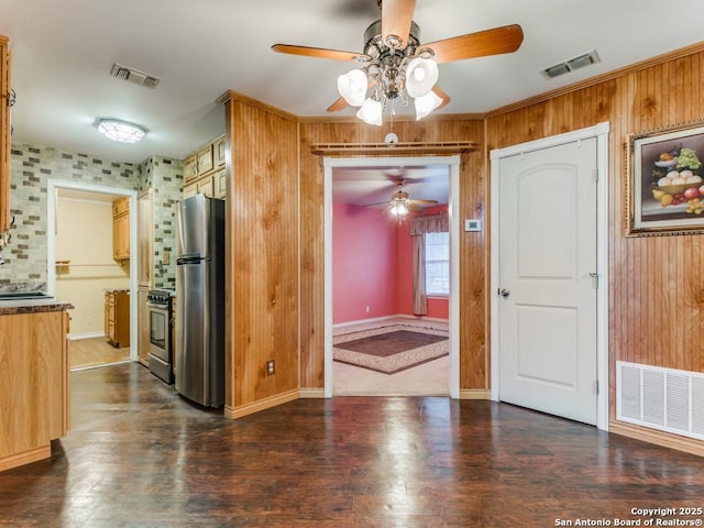 kitchen featuring dark wood-type flooring and appliances with stainless steel finishes