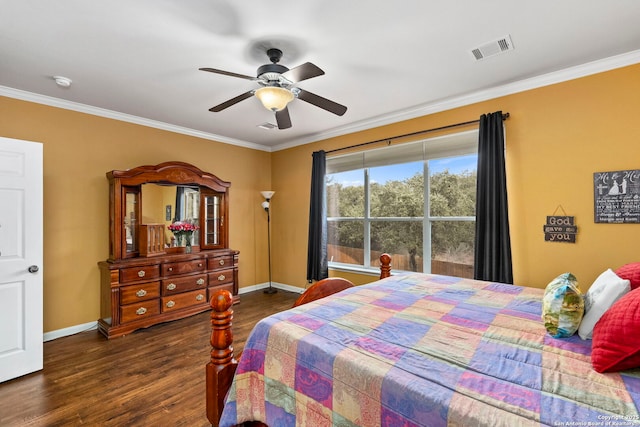 bedroom featuring crown molding, dark wood-type flooring, and ceiling fan