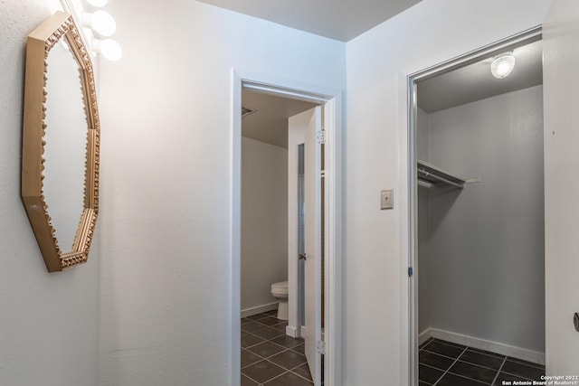 bathroom with tile patterned floors and toilet