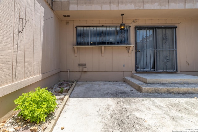 doorway to property with a patio area